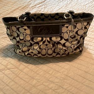 Black and gray coach purse